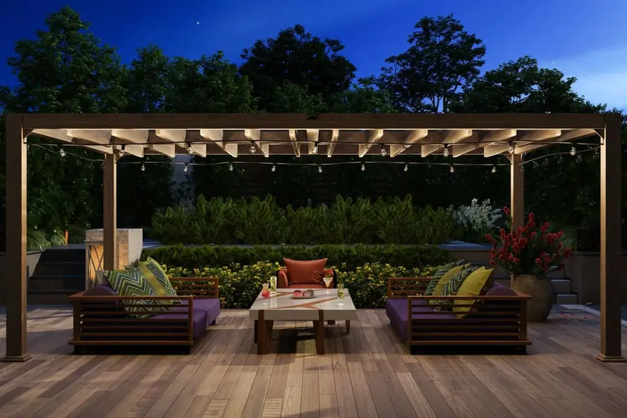Wood deck with outdoor seating under a pergola at dusk