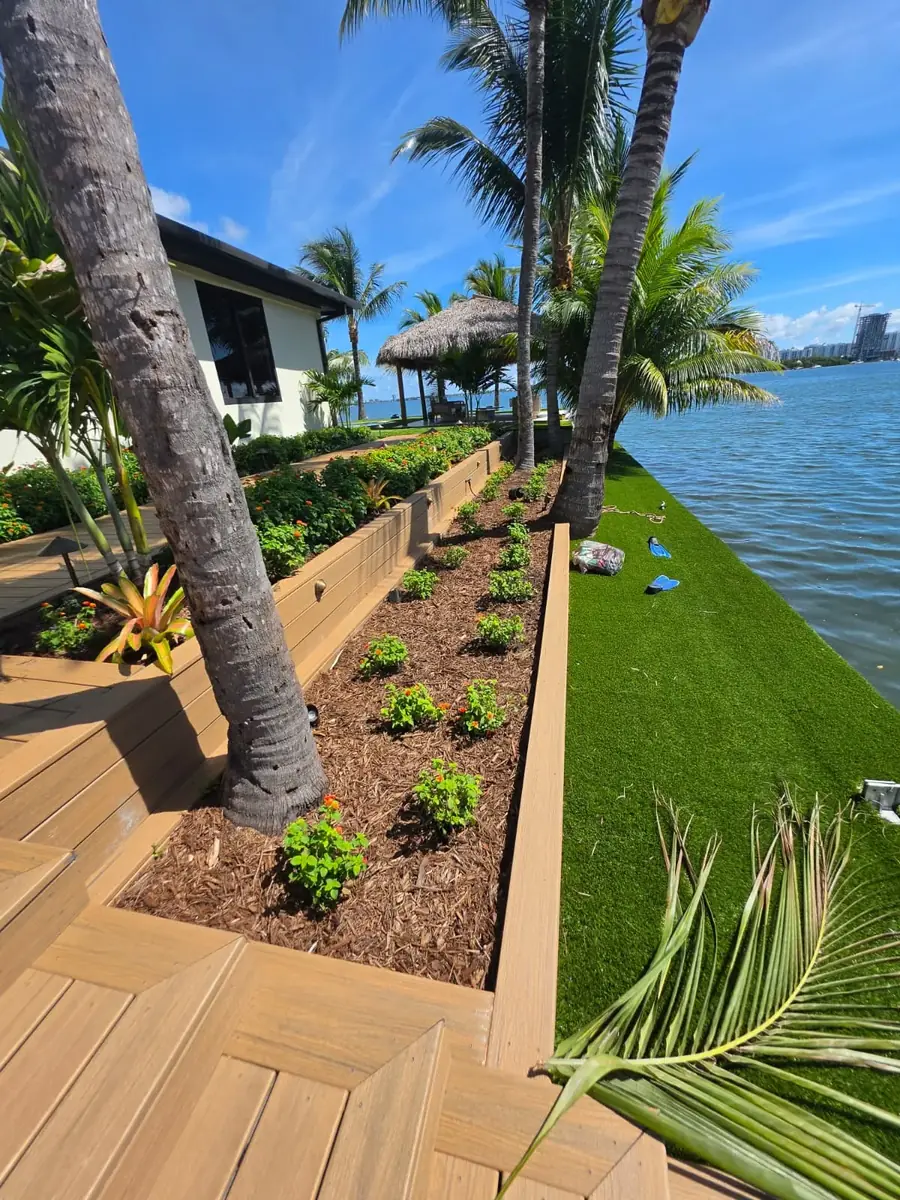 A landscape plan for a home with a pool, lawns and garden paths